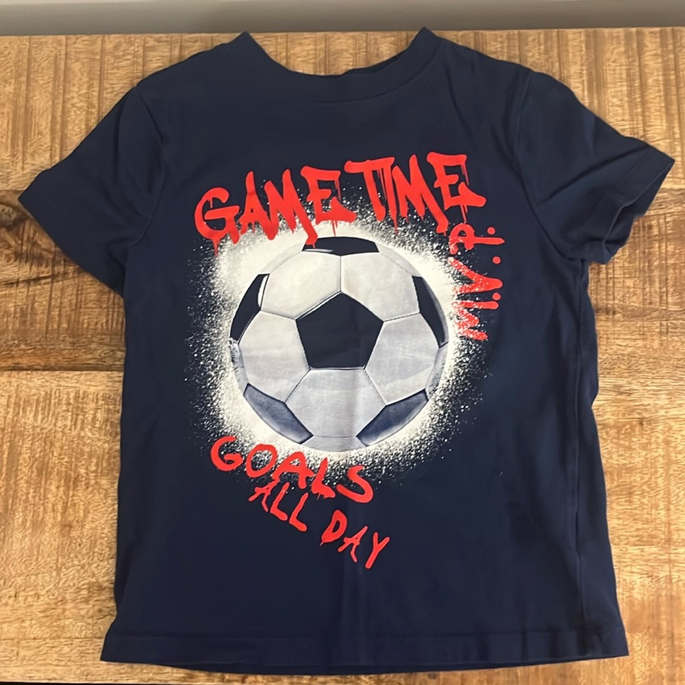 Gently used Carters Boys Navy Soccer casual T-shirt Size XS (between 4T-5T).